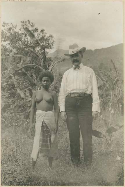 Woman from Bataan standing with Mr. John N. Blair