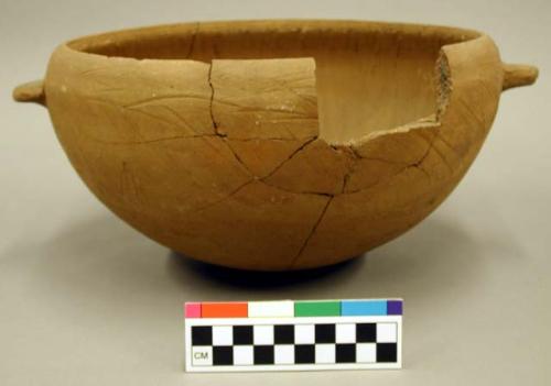 Ceramic vessel, complete, mended, 2 lug handles, micaceous clay, 2 sherds.