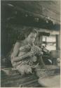 Subano woman braiding cord