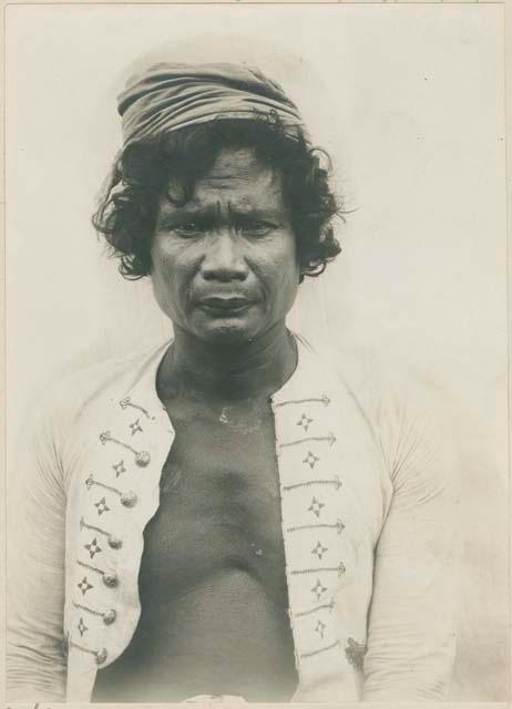 Subano man with curly hair, in Moro dress