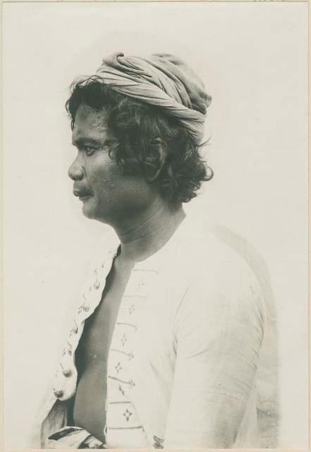 Subano man with curly hair, in Moro dress