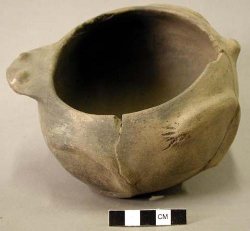 Ceramic vessel, frog effigy bowl, mended, missing body and rim sherds.