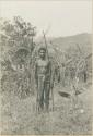 Young man posed with bow and arrows