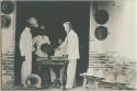 Four men making hats