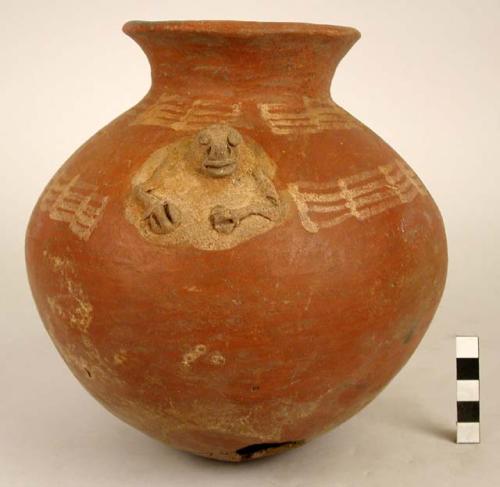 Cabuyal red pottery jar with human figure applique