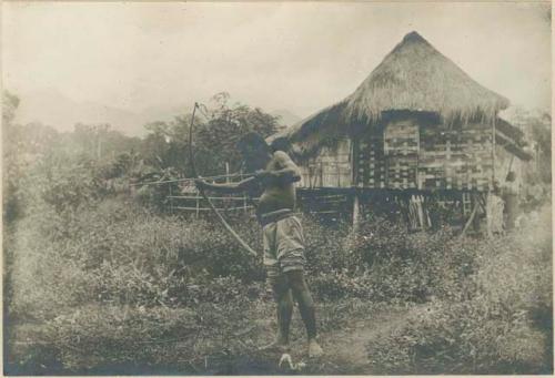 Philippines Negrito men using bows and arrows