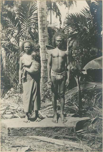 Batak man, his wife, and child