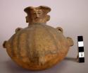 Pottery vessel with effigy on neck