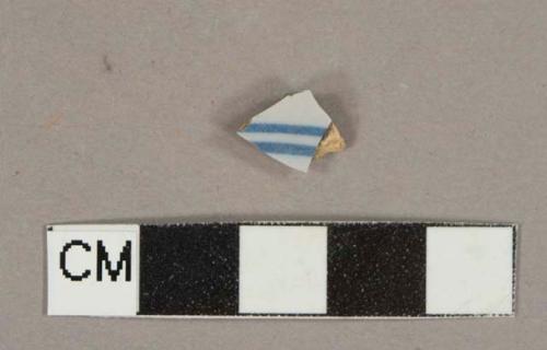 Ceramic, earthenware, tin glaze, blue stripes, body sherd