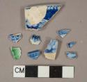 Blue on white transfer decorated pearlware, 4 body fragments, 3 rim fragments, 2 Shell-edged fragments, 1 green and 1 blue