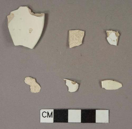 Ceramic, earthenware, whiteware (1), pearlware (3), body sherds; creamware (2), rim sherds