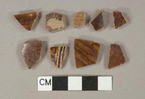 Brown slip glazed earthenware vessel body fragments, buff paste, likely rockingham ware