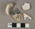 White lead glazed earthenware vessel body fragments, white paste, 1 fragment with light blue and black transferprinted decoration