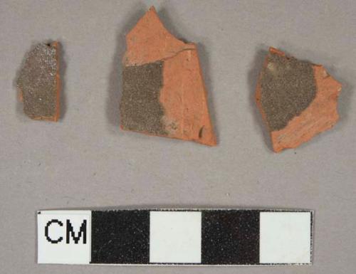 Ceramic, redware, roof tile, architectural, dark brown glaze, fragments