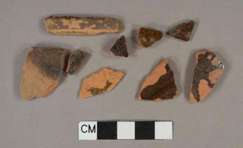 Ceramic, redware, lead glazed: brown interior rim sherds (2); manganese mottled/speckled exterior body sherds (6); brown (1) body sherd.