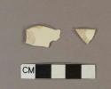 Undecorated creamware rim sherds, one has a possible scalloped edge