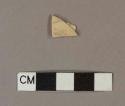 Unidentified refined earthenware body sherd, missing finished surface on both sides