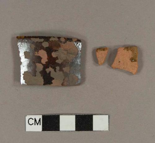 Undecorated lead glazed redware rim sherds; two sherds crossmend