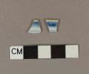 Blue hand painted porcelain rim sherds with brown glaze on top of the rim; two sherds crossmend