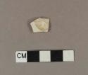 Undecorated pearlware body sherd, possible handle attachment