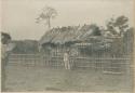 School teacher standing in front of Mangyan school at Banganay