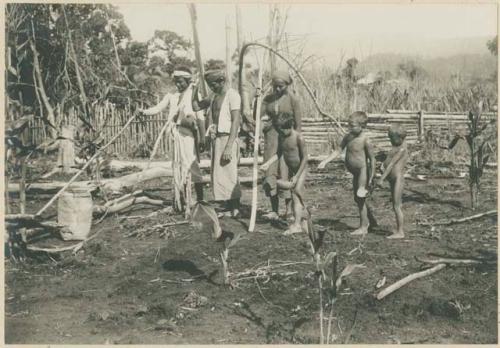 Group of Subano people planting rice