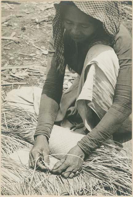 Subano woman weaving a mat