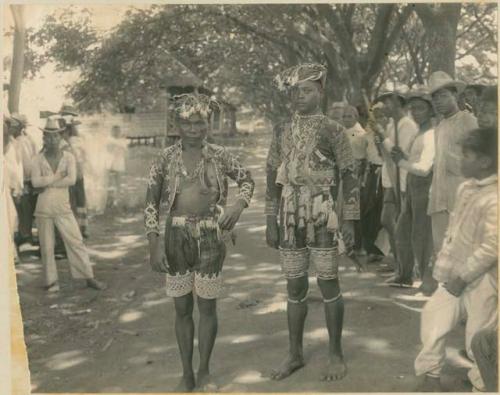 Two men in beaded garments