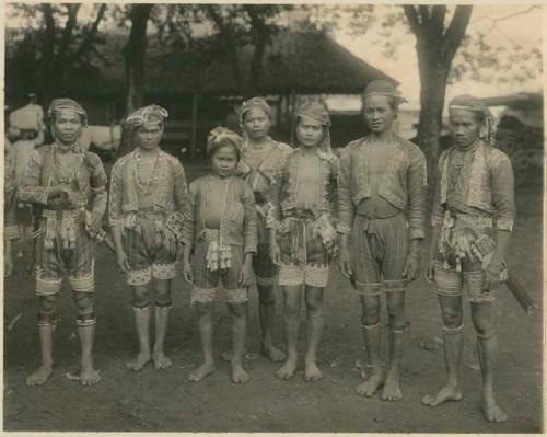 Young men in beaded garments