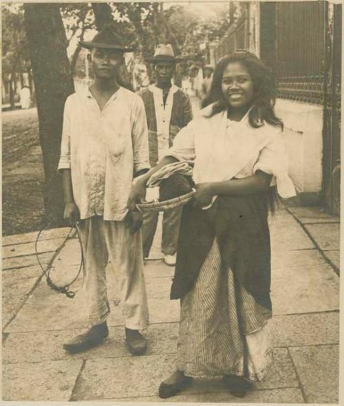 Two men, one woman, western dress