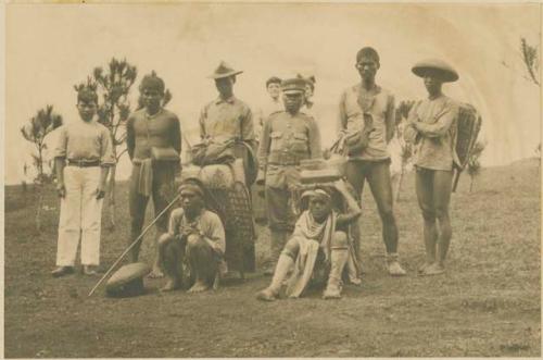 Men, various garments, grass field