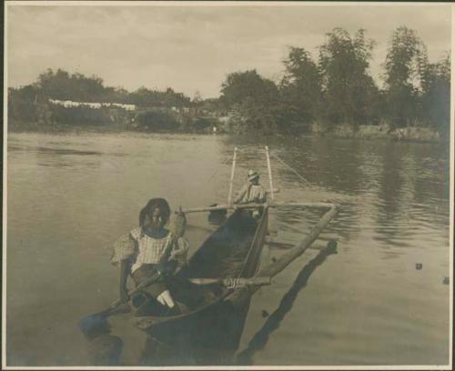 Young man and woman in canoe