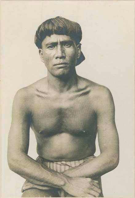 Man with hair cut and tattoo of Bontoc Igorot in Ablug