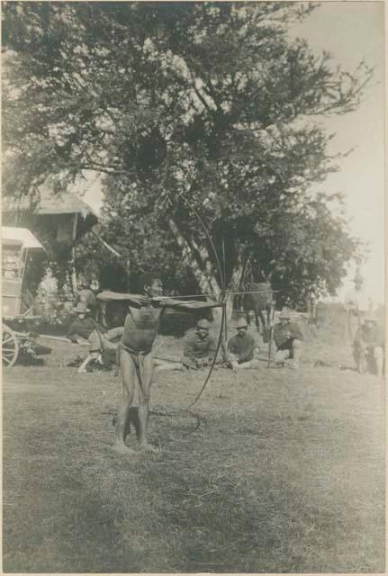 Philippines Negrito man with bow fully drawn