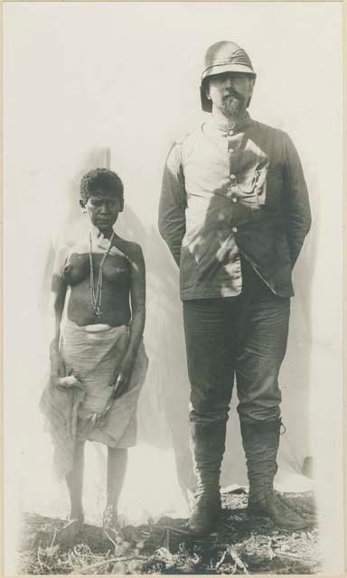 Philippines Negrito woman standing next to a writer