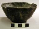 Small polished black pottery bowl