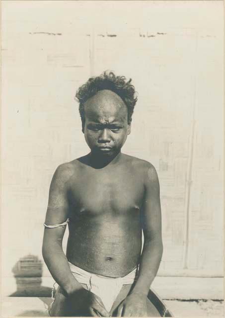 Young Batak man with traditional haircut