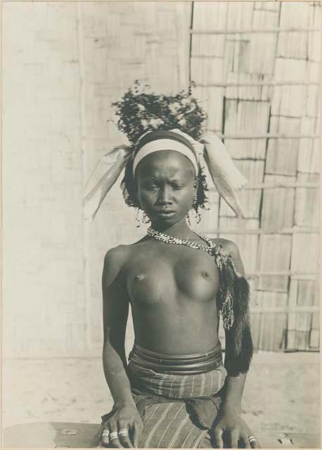 Young Batak woman, with bead and fur ornaments