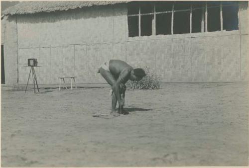 Batak man making fire