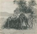 Philippines Negrito men with a hut