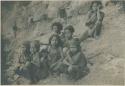 Group of Philippines Negrito people sitting on riverbank