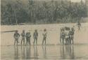 Tingian people on river bank at Masimut