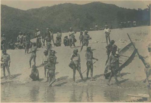 Tingian men with typical small boat