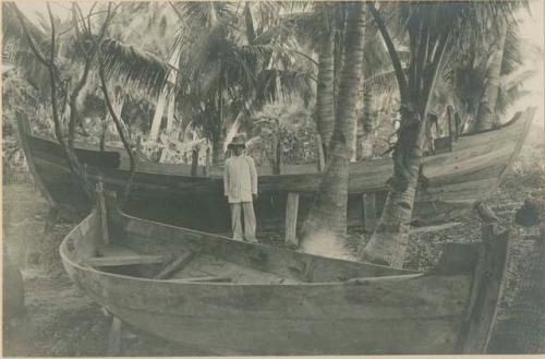 Visayan man with two new bancas (small boats)