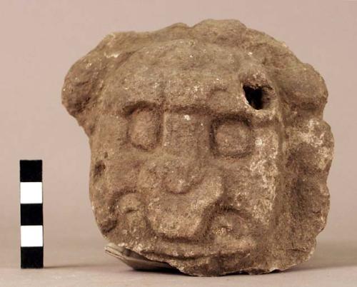 Fragment of sculptures stone head