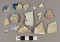 White lead glazed earthenware vessel body fragments, white paste, 9 blue transferprinted decorations, 2 red transferprinted decorations