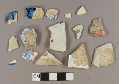 White lead glazed earthenware vessel body fragments, white paste, 9 blue transferprinted decorations, 2 red transferprinted decorations