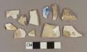 White lead glazed earthenware vessel body fragments, white paste, 3 fragments with blue transferprinted decoration, 2 fragments with brown transferprinted decoration