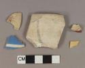 Earthenware vessel body and rim fragments, white paste, 1 red painted, 1 yellow slip glazed, 1 blue and white annular ware