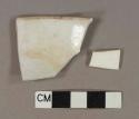 White undecorated porcelain vessel body and rim fragments